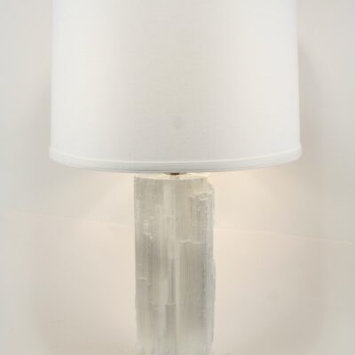 A Modern Natural Stone Selenite Table Lamp with a white shade.