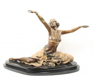 An Art Deco Colinet Thebian Dancer Bronze Statue with her arms outstretched.