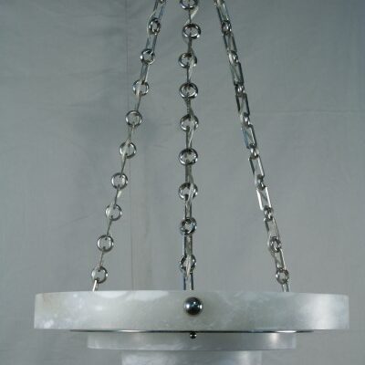 A close-up of an Art Deco Ruhlmann Style Tiered Alabaster Chandelier.