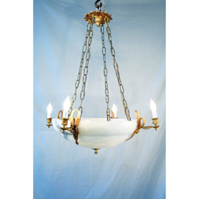 A chandelier with six lights hanging from chains.