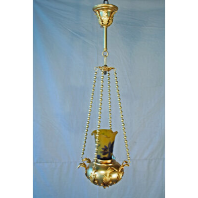 A gold hanging lamp with a yellow vase.