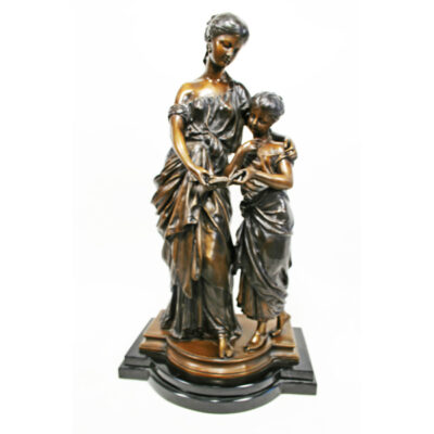 A statue of two women holding hands.