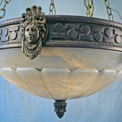 A close up of the head on a chandelier