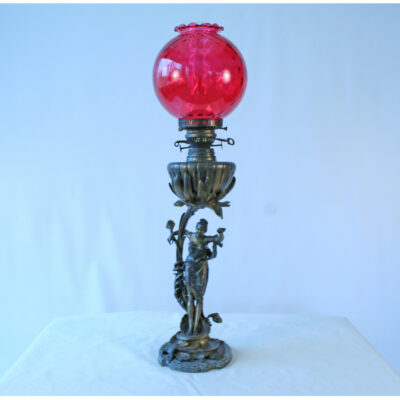 A red lamp sitting on top of a table.