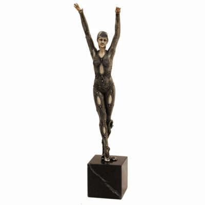 A statue of a woman with arms raised.